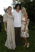 Missy Hargraves with Howard Stern and Beth Ostrosky.