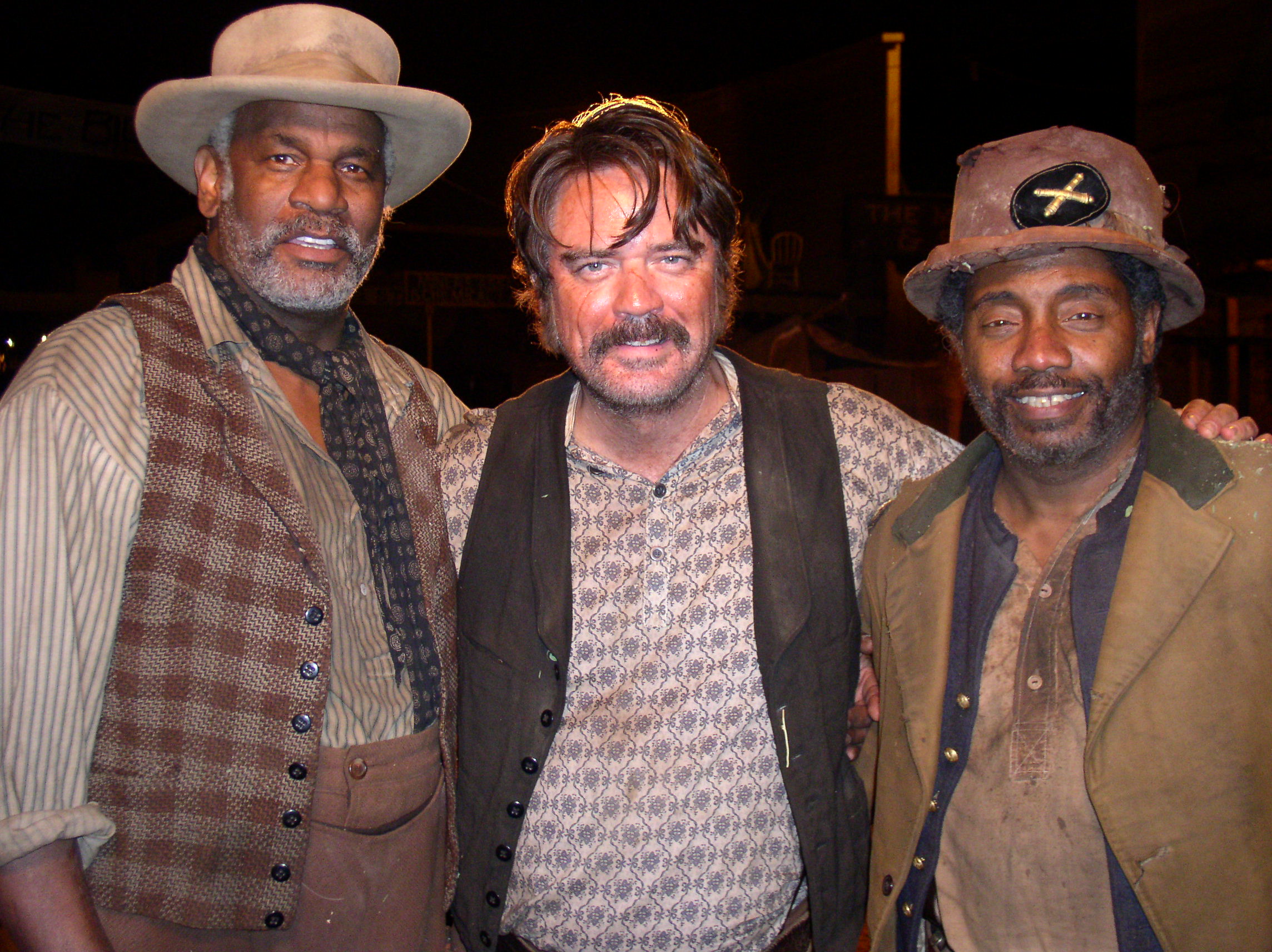 Richard Gant , Michael Harney and Franklyn Ajaye on Deadwood set .