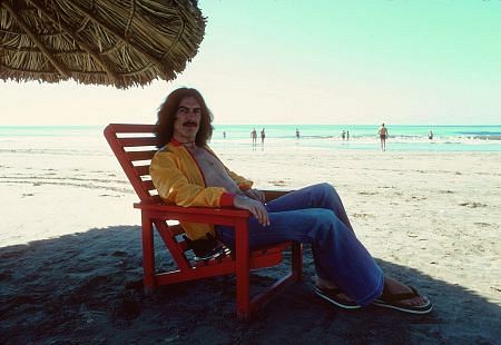 George Harrison in Acapulco enjoying the shade on the beach, January 1977