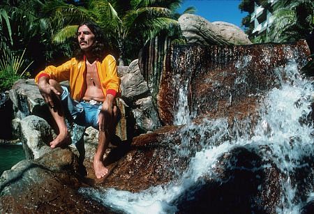 George Harrison on the watery rocks in Acapulco, January 1977
