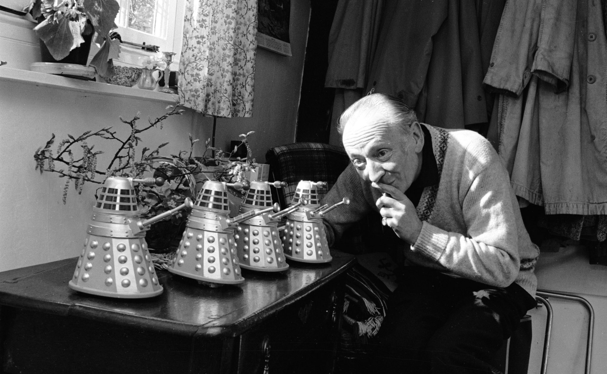 21st April 1965: British actor, William Hartnell (1908 - 1975) at home in Mayfield, Sussex with four miniature model Daleks - arch enemies of Hartnell's character Dr Who in the BBC's science-fiction series of the same name. Hartnell was the first of a series of actors to play the role.
