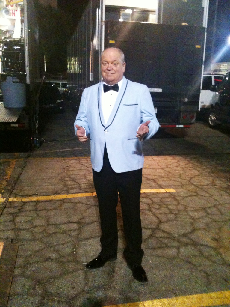 Jerry Hauck as the Premiere MC on the set of 'Saving Mr. Banks' (2013).