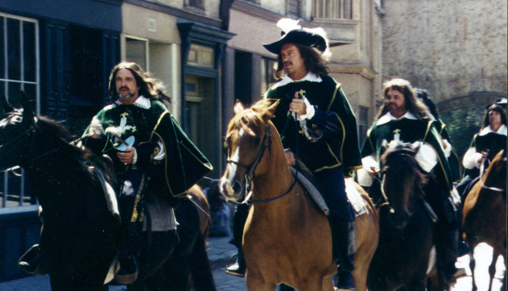 Dennis Hayden as D'Artagnan and William Richert as Aramis Coming back from battle.