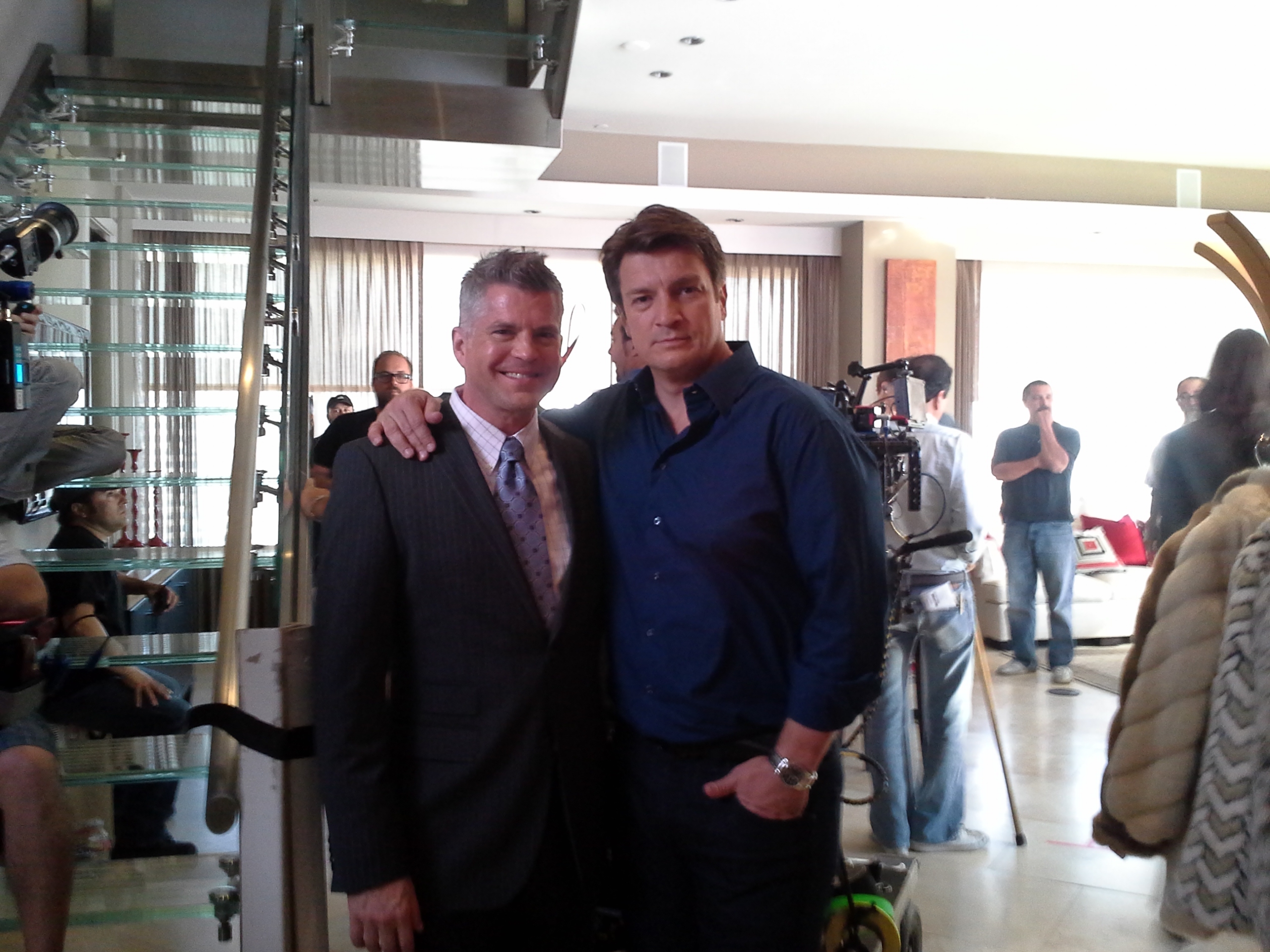 Jesse Henecke and Nathan Fillion on the set of CASTLE