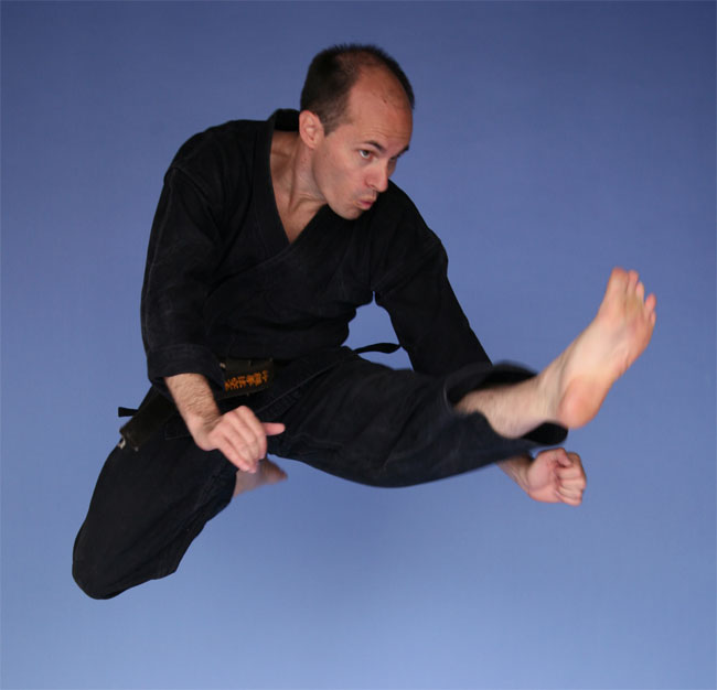 2nd Dan - Okinawa Kenpo Karate, performing mae tobi geri (jump front kick)
