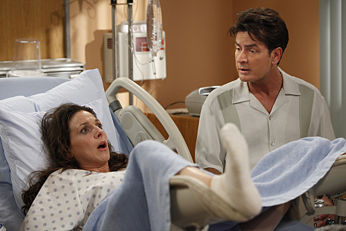 Still of Charlie Sheen and Marin Hinkle in Two and a Half Men (2003)