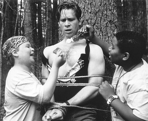Brawn is no match for brains when Gerry (Aaron Schwartz, left) and Roy (Kenan Thompson, right) take control of the camp and use their clever wits to retaliate against the bully counselors including Lars (Tom Hodges, center), who have made their summer unbearable.