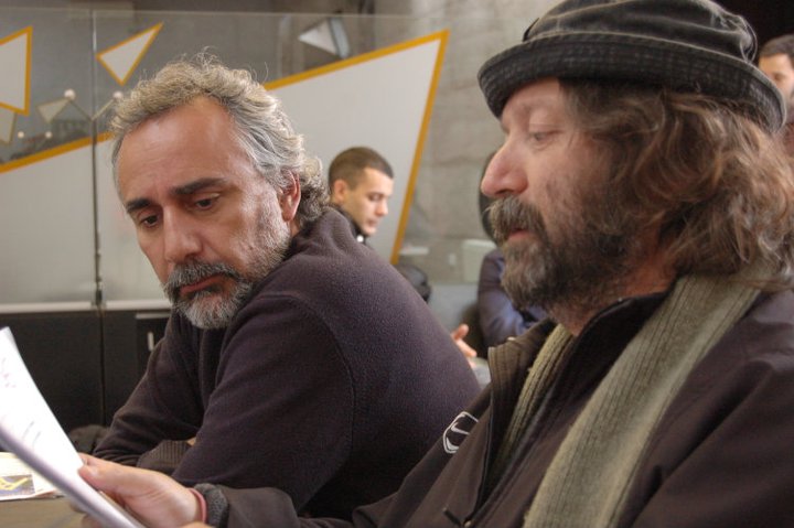 With director Sergio Schmucler taking a final look at the scene script in 