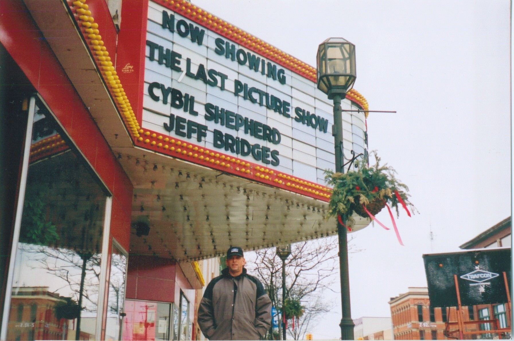 Writer-Director Anthony Hornus on location for An Ordinary Killer. The film is based on a true story of a serial killer. The marquee shows a film, The Last Picture Show with Cybil Shepherd and Jeff Bridges, that was popular in 1973 when the story begins.