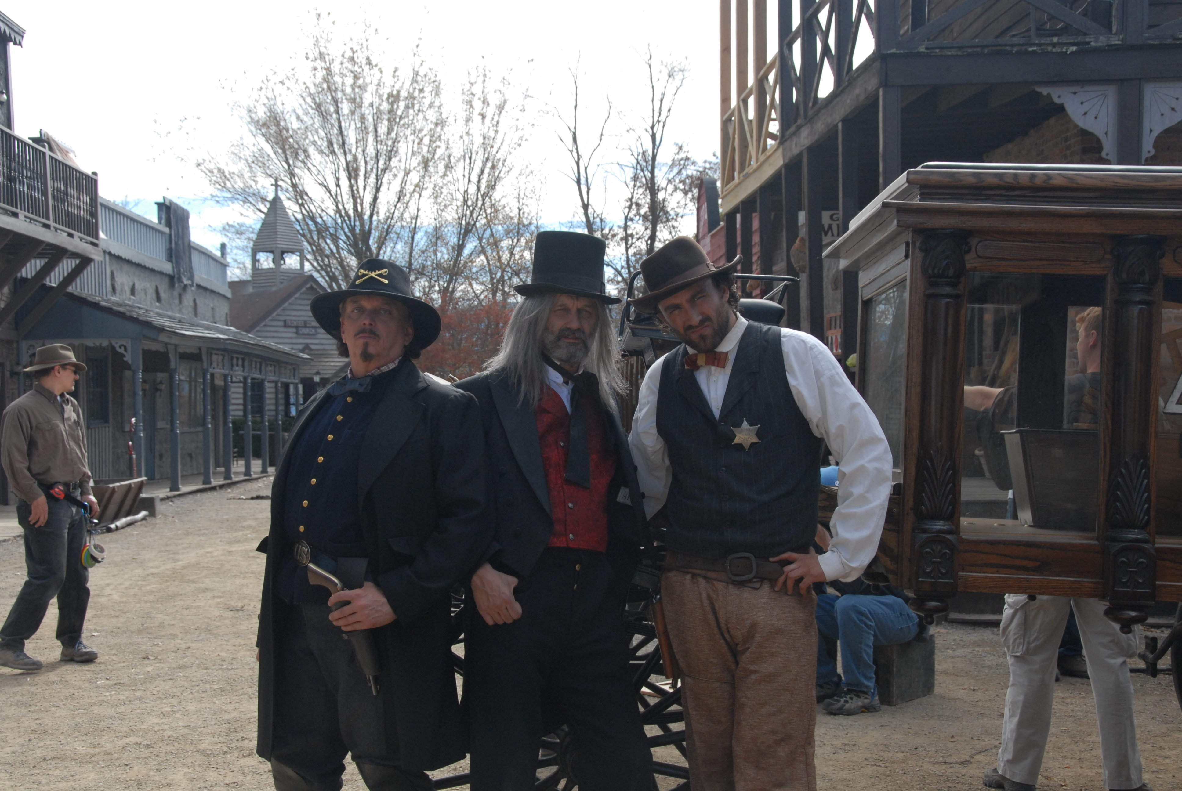 From left, actors Anthony Hornus as Captain Ketner (An Ordinary Killer, Miracle at Sage Creek), Dean Teaster, as Digger (Figure in the Forest, An Ordinary Killer, ER) and Taymour Ghazi, Deputy Wilson (Tangy Guacamole) on the set of Ghost Town, filmed in M