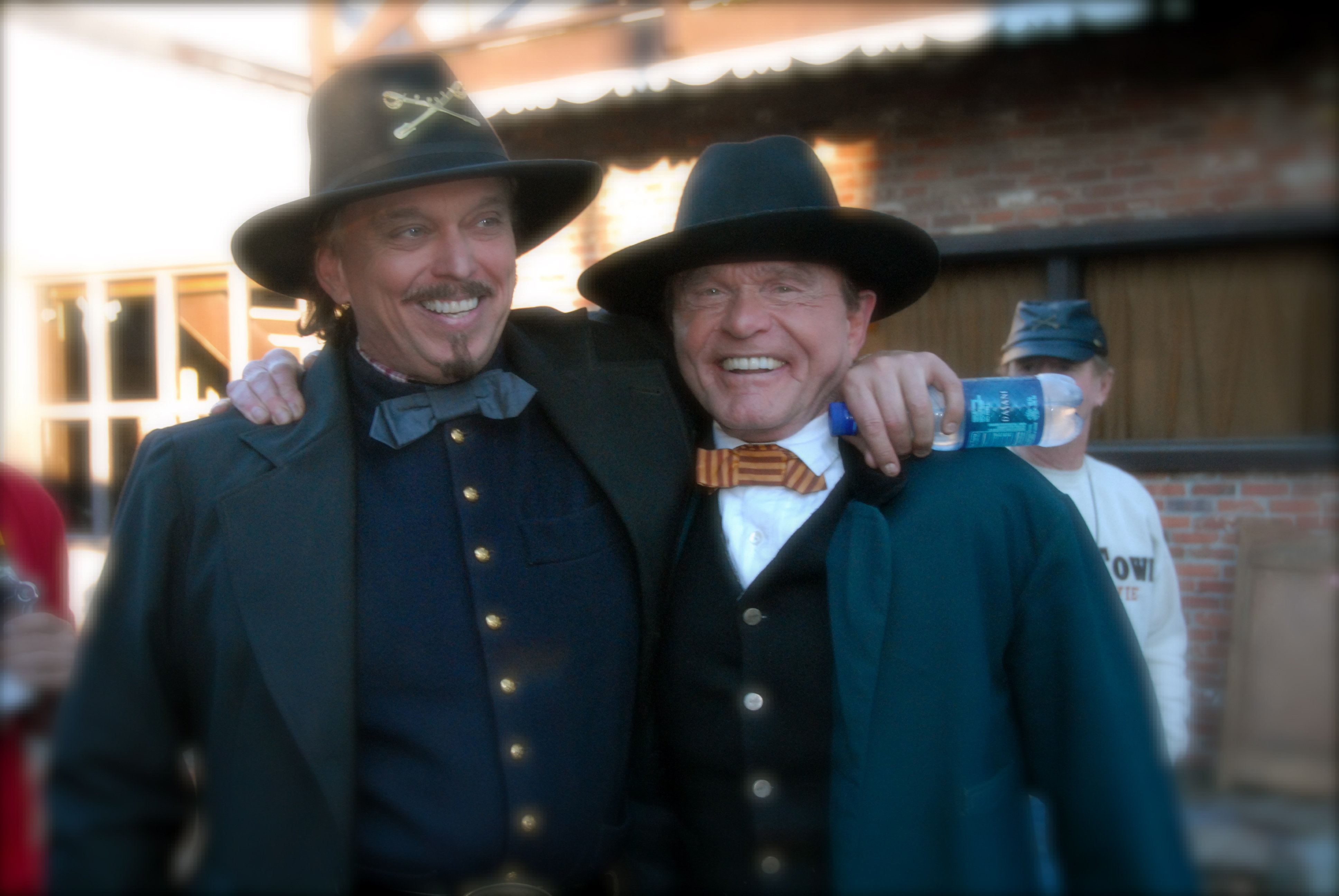 Actors Anthony Hornus, left (Wicked Spring, Miracle at Sage Creek, An Ordinary Killer) shares a hug with Bill McKinney (Deliverance, The Outlaw Josey Wales, The Green Mile), during the wrap of principal photography on Ghost Town, an action/drama filmed in