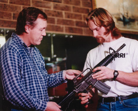John Fox with Action Film Director Brent Houghton looking at the 5.56mm Colt M16A1 Carbine with short 12