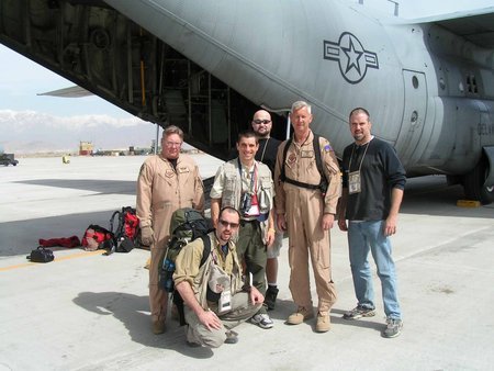 Spencer Humm poses with a USAF C130 crew in Bagram, Afghanistan during the shooting of the comedy documentary 