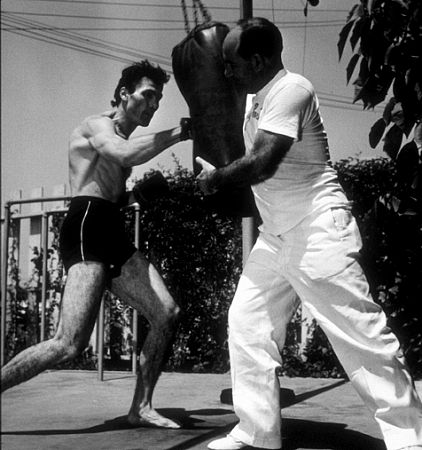 Jack Palance and Hollywood trainer, Terry Hunt, 1954.