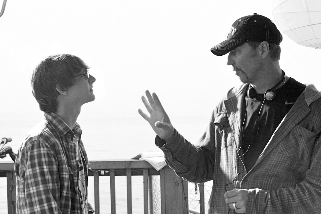 Iliff directing Ryan Donowho on set in Isla Vista filming 