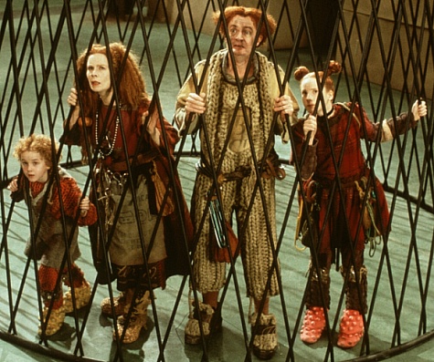 The Clock family - Peagreen (Tom Felton), Homilly (Celia Imrie), Pod (Jim Broadbent) and Arrietty (Flora Newbigin) behind bars.