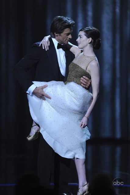 Hugh got game - Here with Anne Hathaway, Hugh Jackman sang and danced his way through his hosting gig for the Oscars, bringing a little Broadway charm to Hollywood.