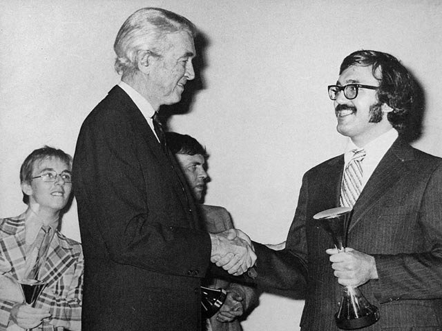 James Stewart presents Storm 2nd Unit DP Andrew Jaremko with an award for VOODOO at the 10 Best Films awards. London, 1975.