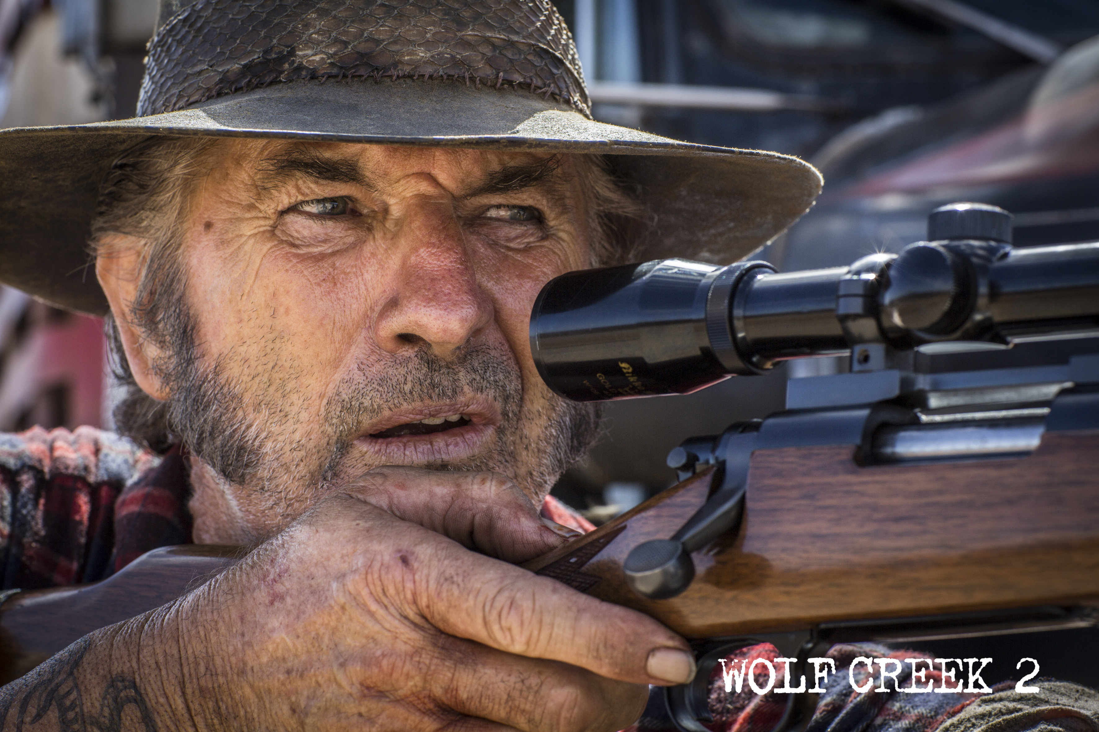 John Jarratt as Mick Taylor