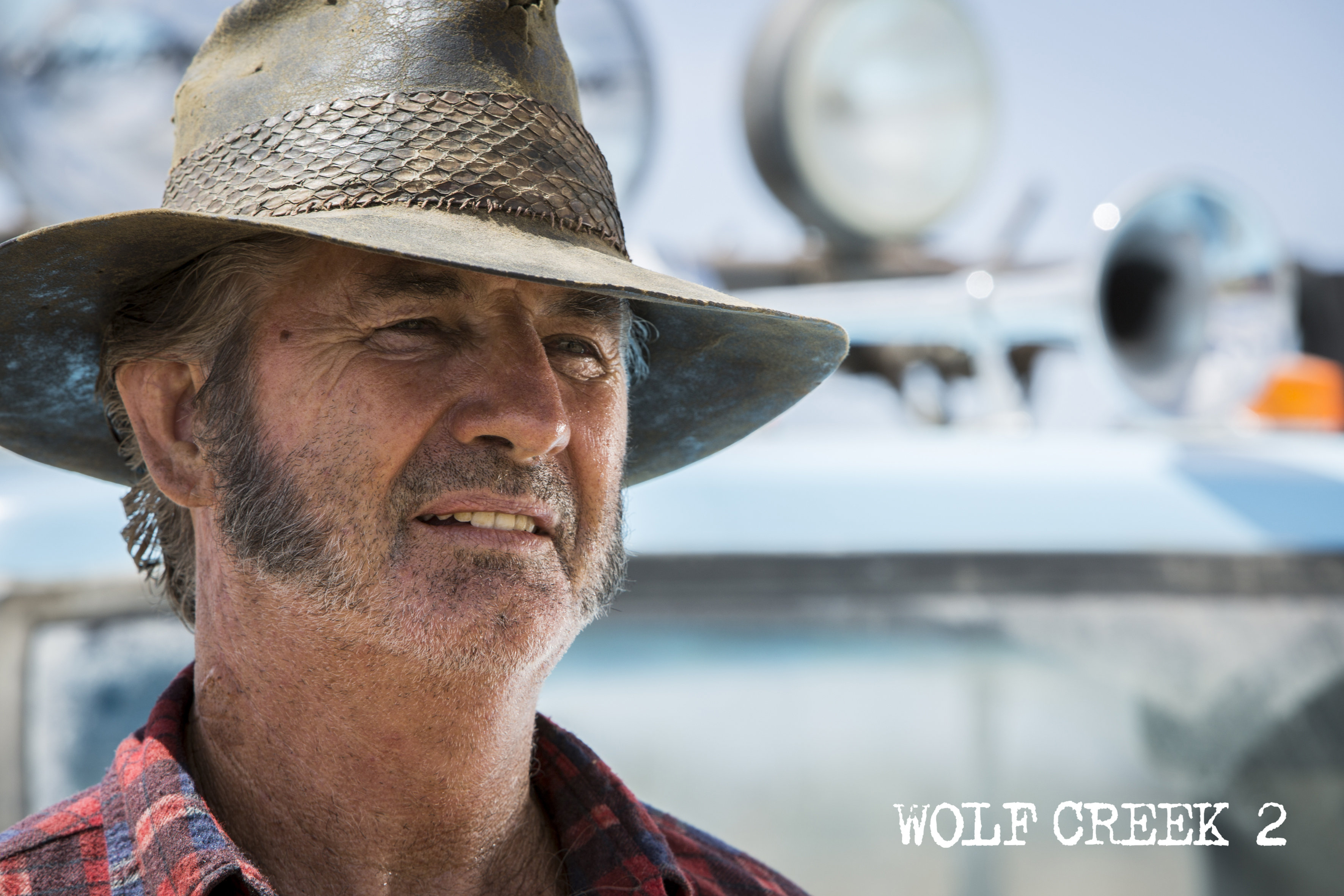 John Jarratt as Mick Taylor