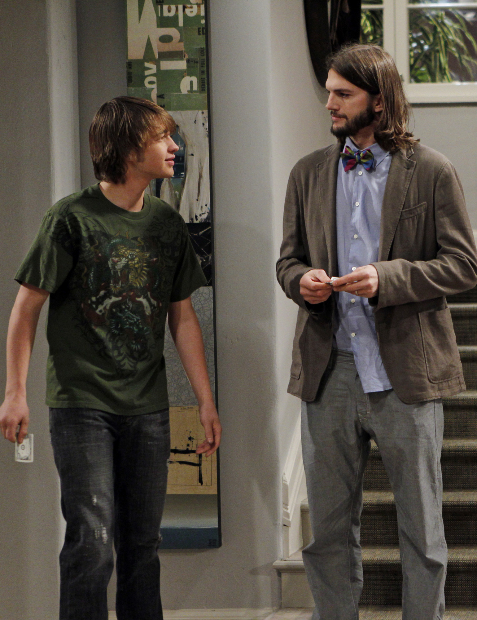 Still of Ashton Kutcher and Angus T. Jones in Two and a Half Men (2003)