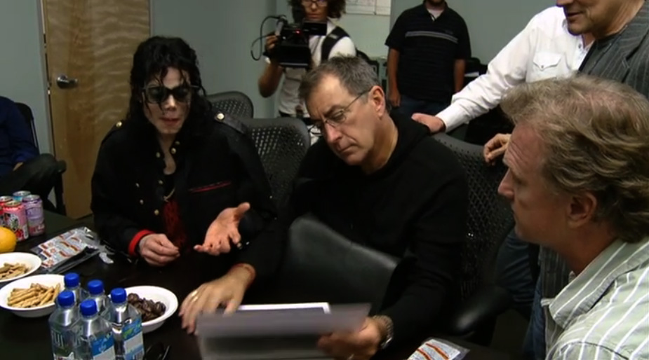 Michael Jackson, Kenny Ortega, and Bruce Jones reviewing story boards during prep for the 