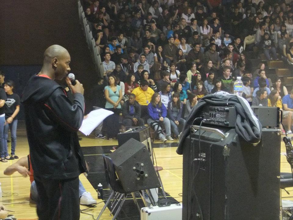 Tank speaking at a high school