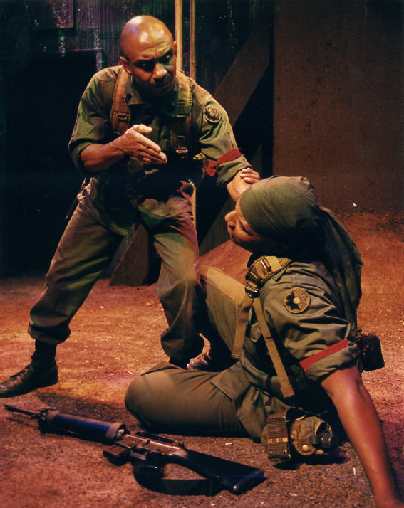 Photo from the award winning military play, Niggaz with Attitudes and Big Guns. Ty Granderson Jones (left) portrays crazed soldier, Master Sgt. Cobb. Ty recieved an ADA nod for Lead Actor in a Play - Drama. Layon Gray (down right).