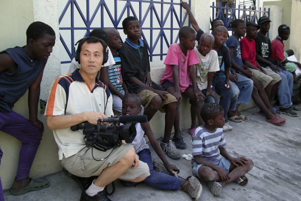 Young Man Kang, Director/Producer of YMK Films, with Haitian Street Kids in Port-au-Prince, Haiti (01/01/2009)