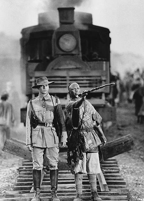 Still of Val Kilmer and John Kani in The Ghost and the Darkness (1996)