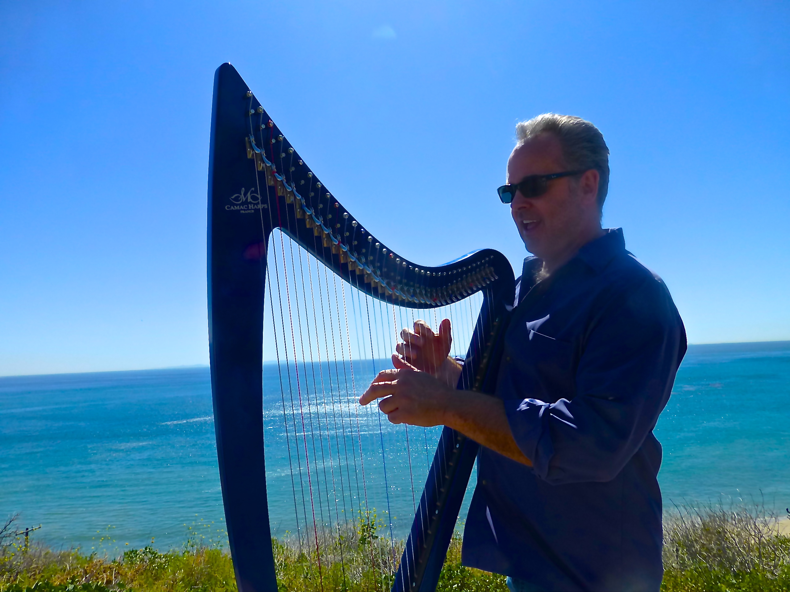 Chris Kinkade playing his Blue Electric Camac harp 