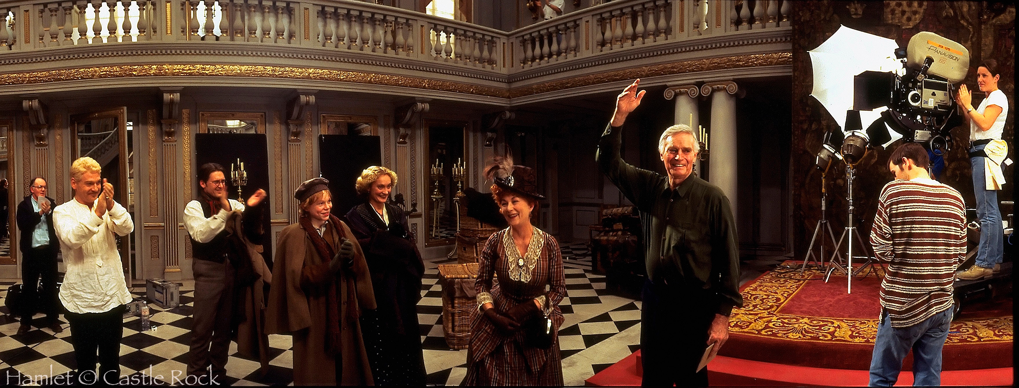 Hamlet. 1996 Directed by Kenneth Branagh Charlston Heston is greeted by the film crew crew after his last shot on Hamlet