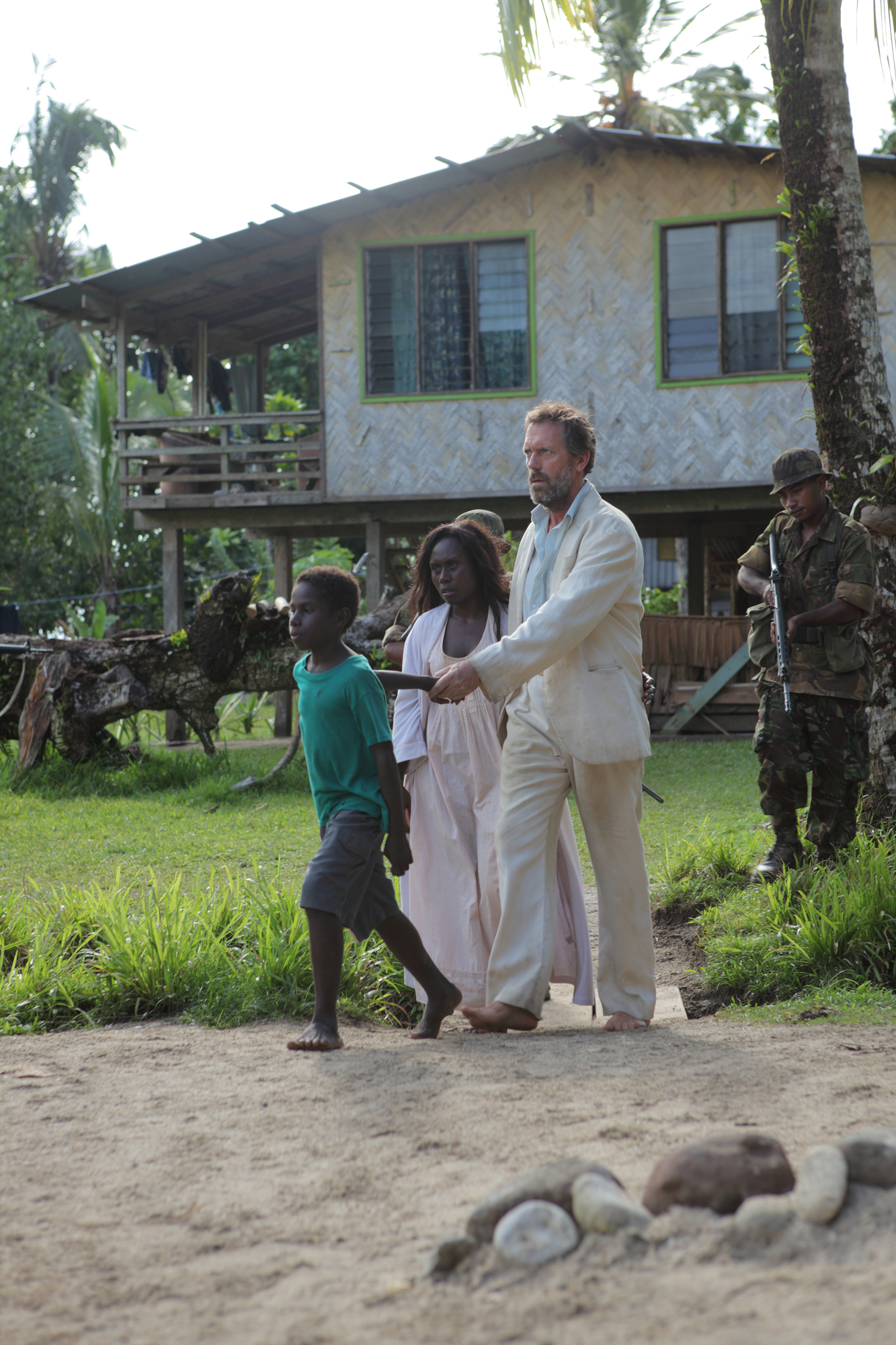 Still of Hugh Laurie and Florence Korokoro in Mr. Pip (2012)
