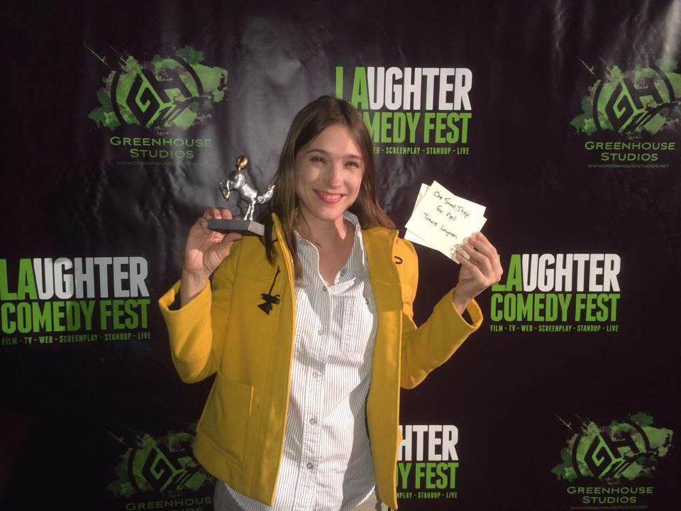 Writer/Director Tracie Laymon receives the Jury Prize for Best Screenplay for her script ONE SMALL STEP FOR NEIL at the LA Comedy Festival.