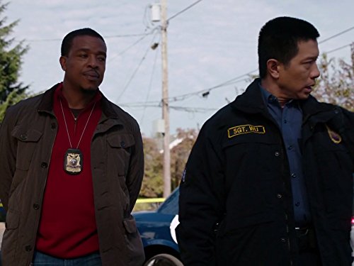 Still of Russell Hornsby and Reggie Lee in Grimm (2011)