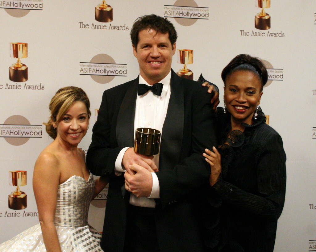 Presenters Jen Cody and Jenifer Lewis flank TV music winner Guy Moon