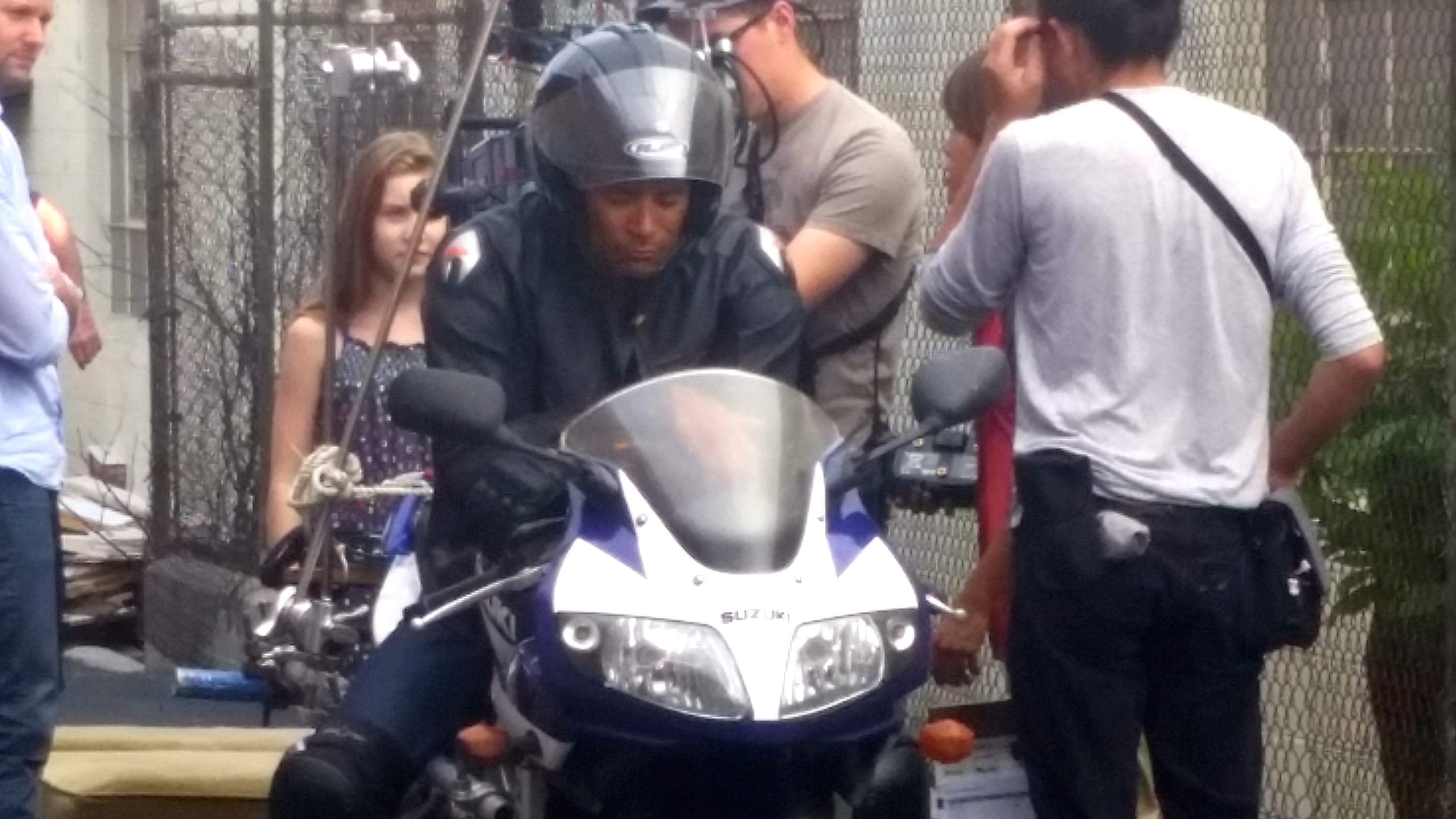 Stunt driver w Phantom rig on Kawasaki motorcycle.