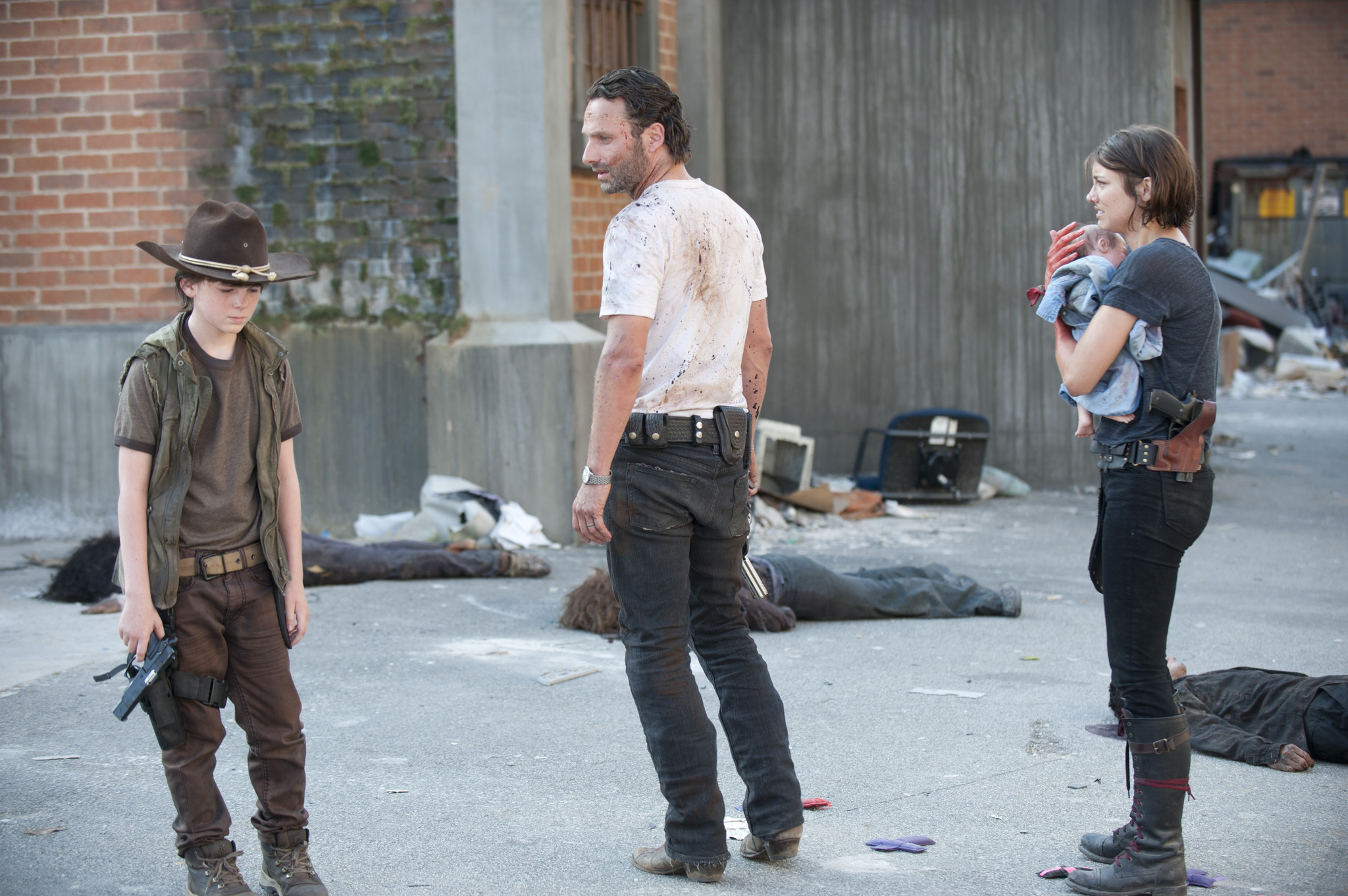 Still of Andrew Lincoln, Lauren Cohan and Chandler Riggs in Vaiksciojantys negyveliai (2010)