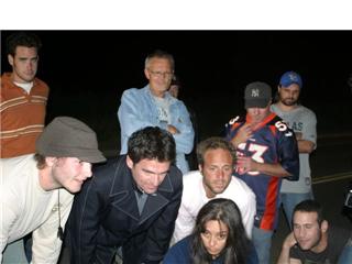 Marty Lindsey (Writer/Director) with crew of Sububran (2007)watching playback on monitor