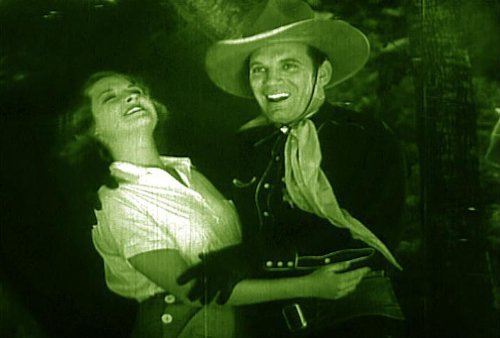 Phoebe Logan and Fred Scott in The Fighting Deputy (1937)