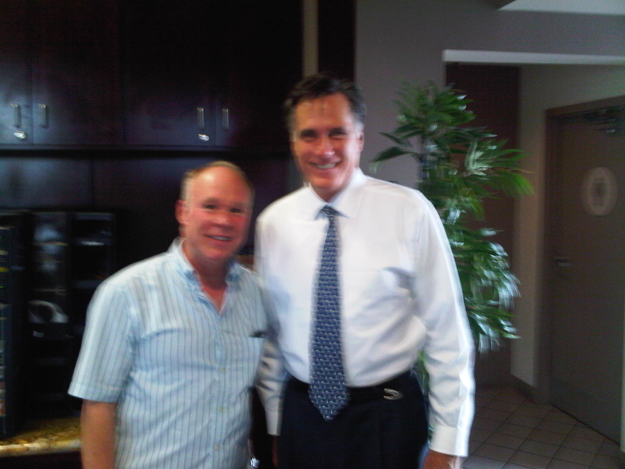 Tom Logan directs Mitt Romney.