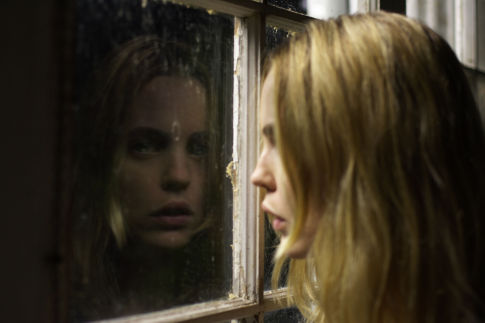 MELISSA GEORGE stars as Kathy Lutz in THE AMITYVILLE HORROR.