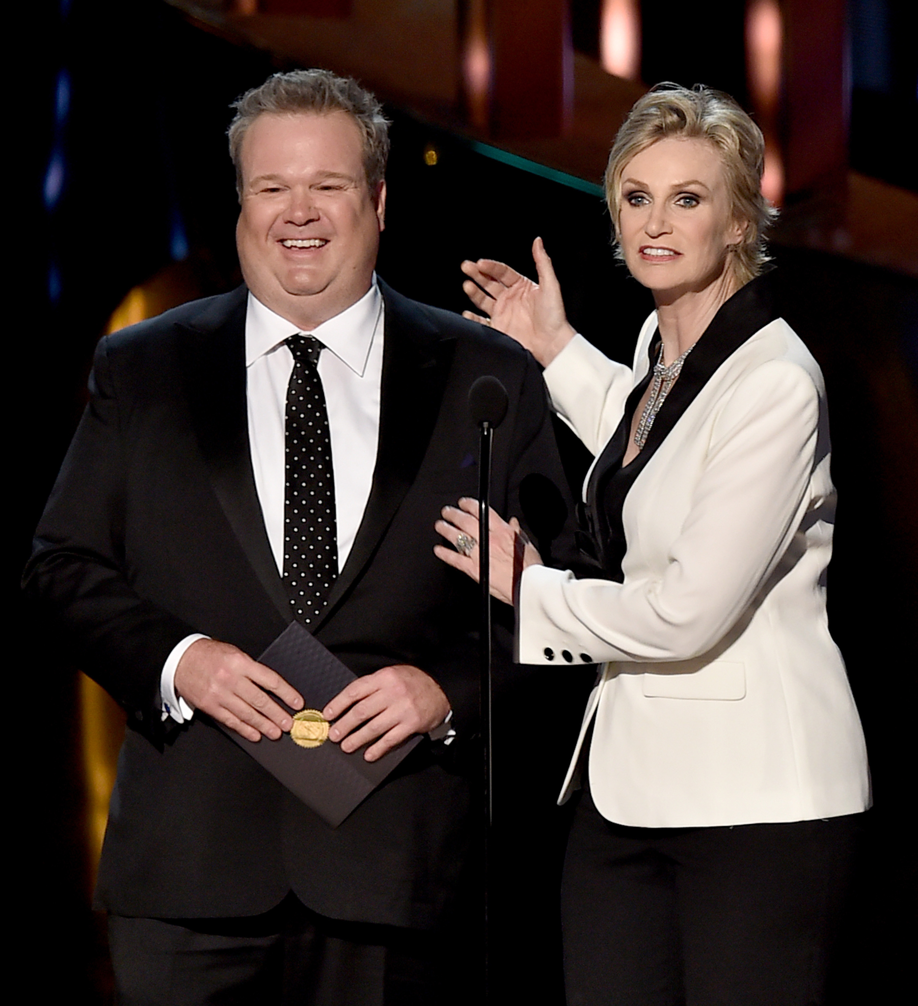 Jane Lynch and Eric Stonestreet at event of The 67th Primetime Emmy Awards (2015)