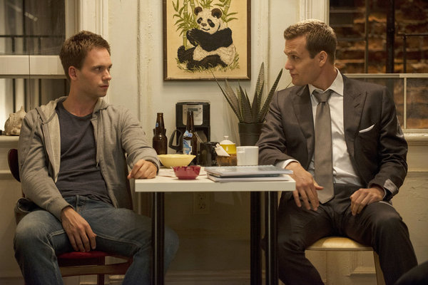 Still of Gabriel Macht and Patrick J. Adams in Suits (2011)