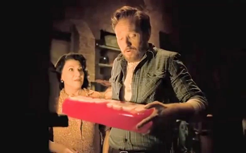 Irina with Conan O'Brien in an American Express commercial.