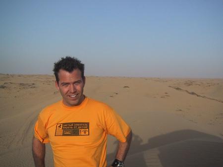 Neil Mandt on location in the Arabian Desert.