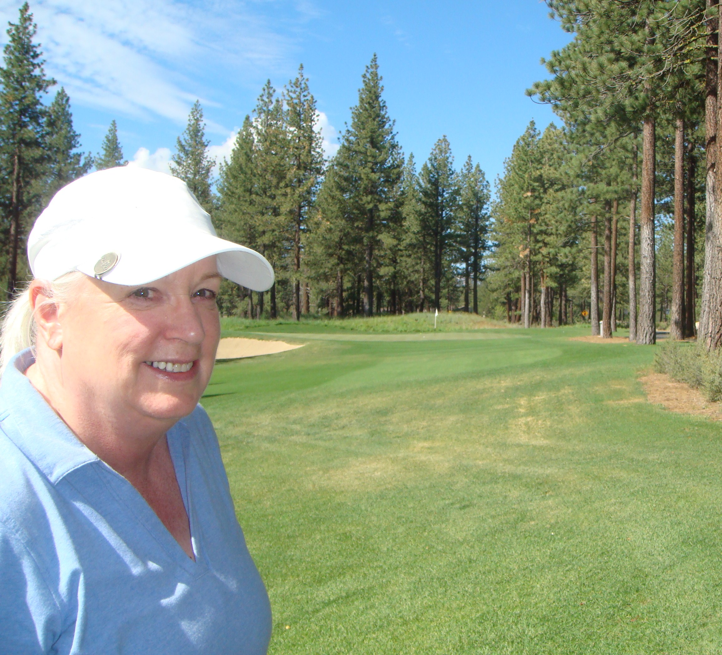 Sharon golfing at Tahoe and getting a birdie.