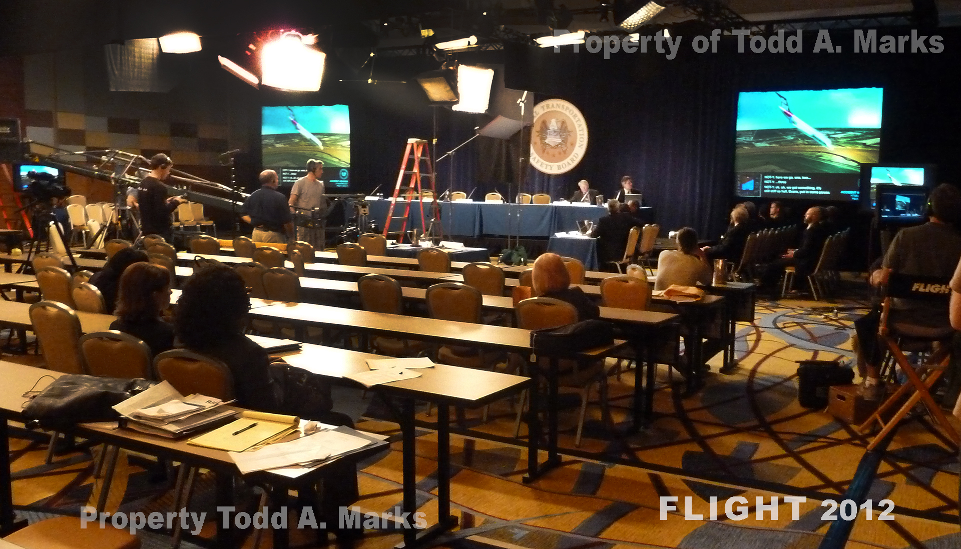 NTSB Hearing - Projection Screens and Monitors showing a simulation from the info on the flight recorder (black box). FLIGHT