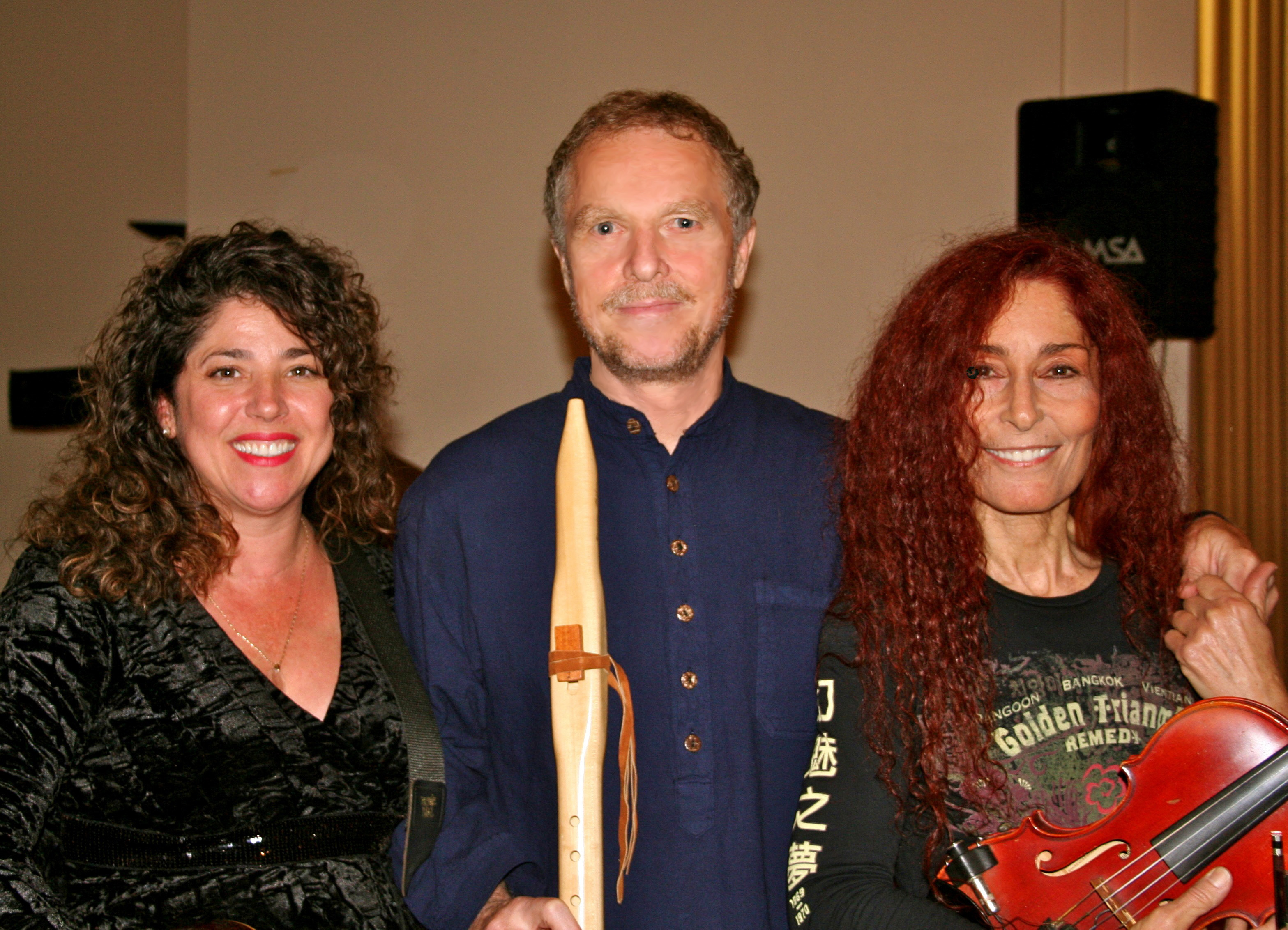 From left - Cecilia Saint King, William Waterway, Sharon Benson. Sharing a moment after the playing at the United Nations' International Peace and Ecology Vigil in Central Park's Bandshell.