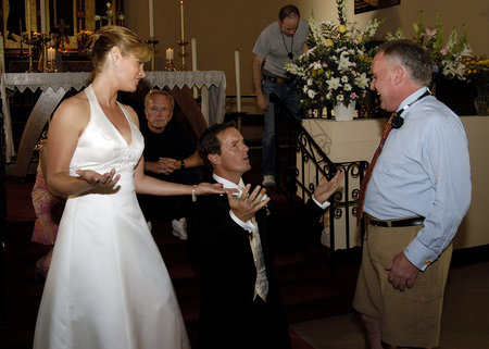 Shannon & Linden joke around during the wedding scene as Director Doug Jackson looks on during the filming of 